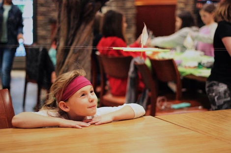 82520529_2900813813478277_2790846663491584000_n A girl at a table watches as a project is tested at a US space camp